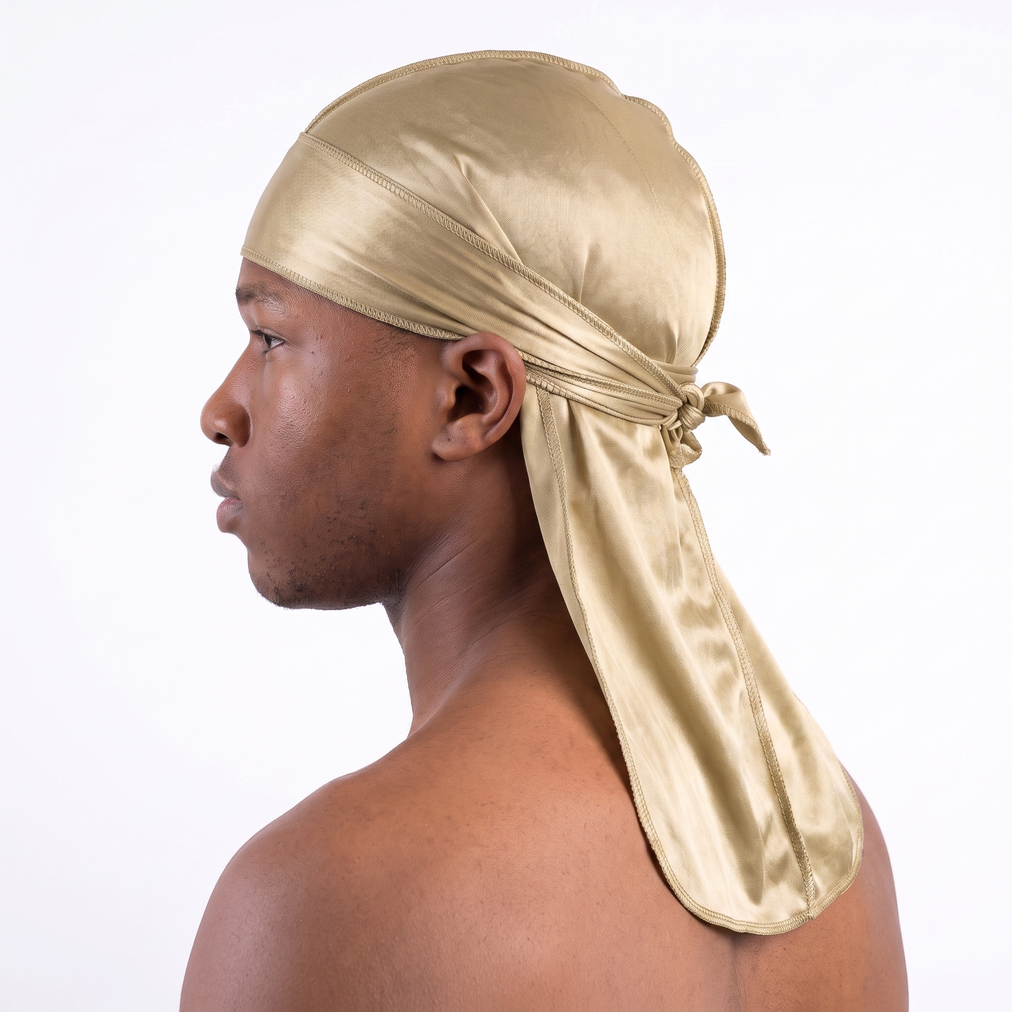 Premium Champagne Gold Silk Durag worn by male model, side profile showing fit and tail drape