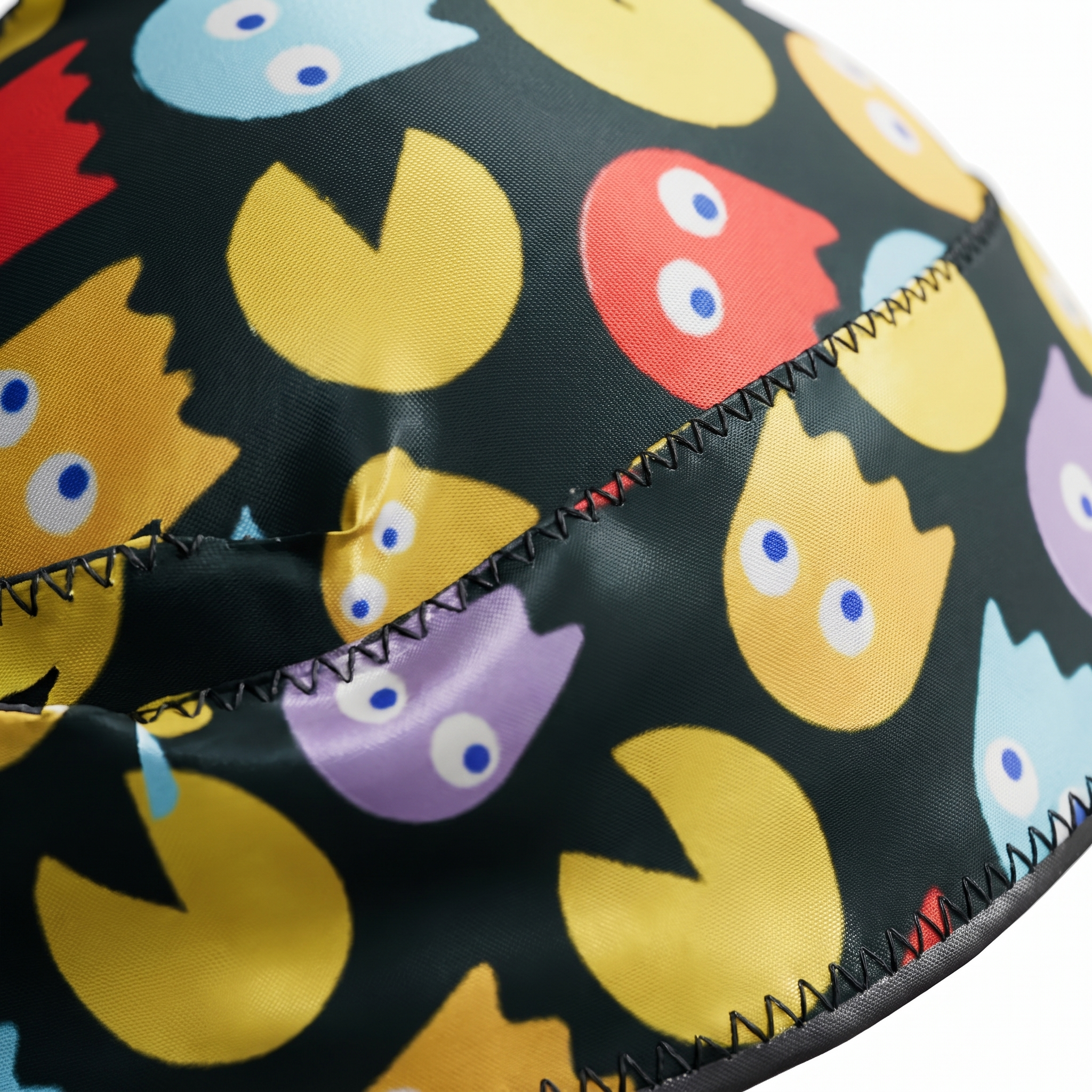 Pac-Man retro arcade Satin Silky Durag fabric close-up showing Pac-Man retro arcade print and stitching detail