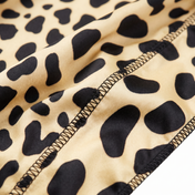 Cheetah spotted animal print Satin Silky Durag fabric close-up showing Cheetah spotted animal print print and stitching detail