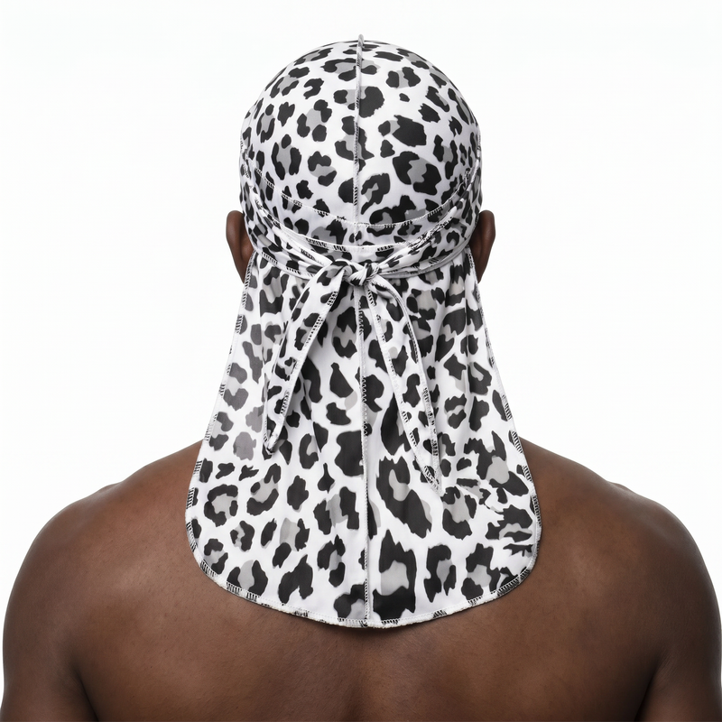 Snow Leopard spotted animal print Satin Silky Durag worn by male model, back view showing tied wrap and tail
