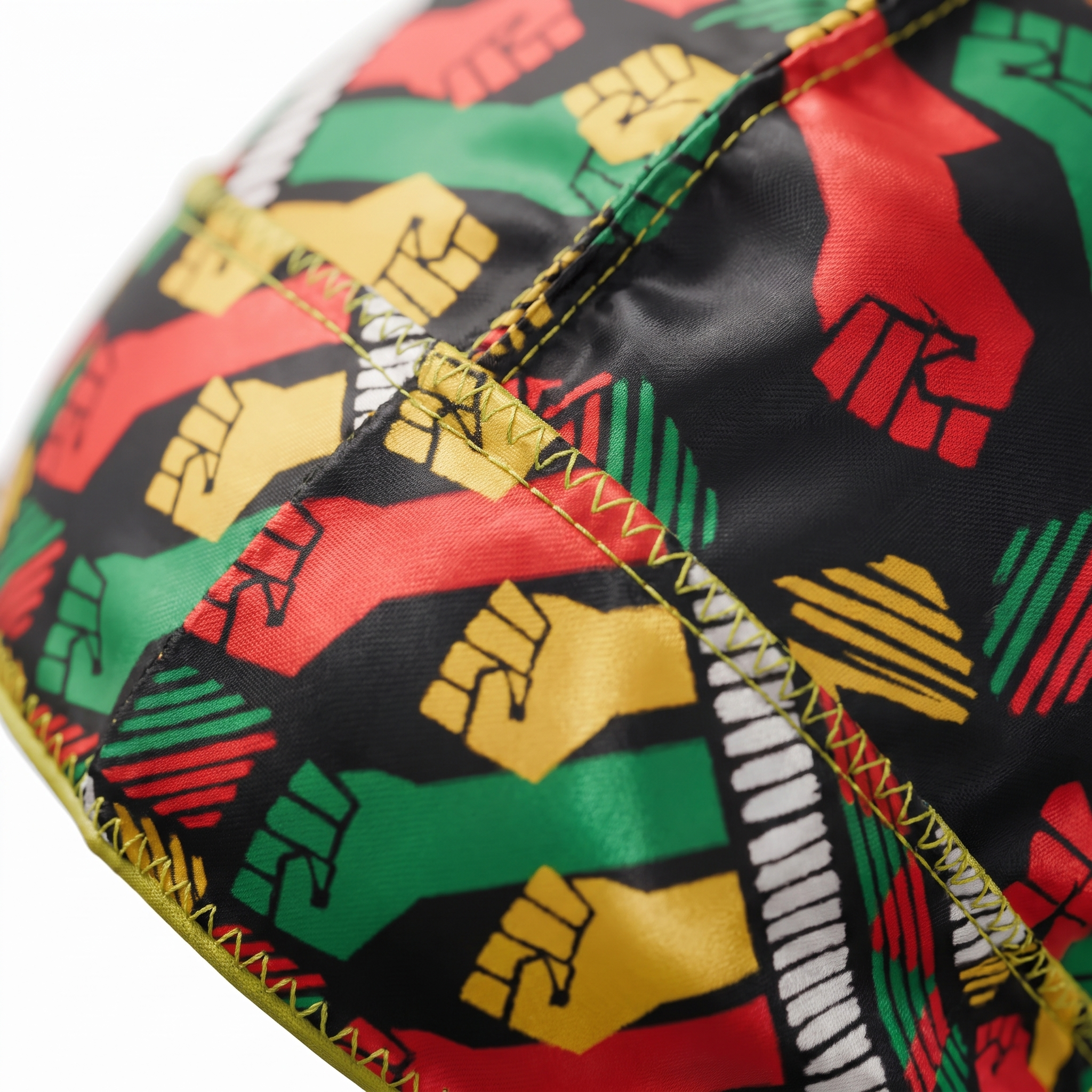 Juneteenth 6.0 red black and green Satin Silky Durag fabric close-up showing Juneteenth 6.0 red black and green print and stitching detail