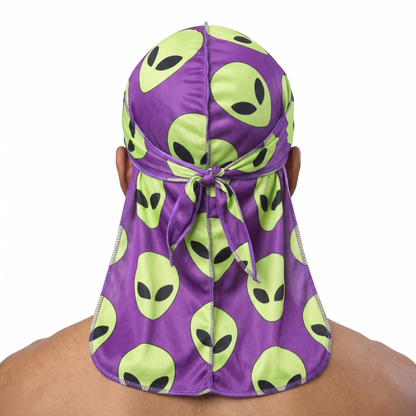 Alien Purple graphic Satin Silky Durag worn by male model, back view showing tied wrap and tail