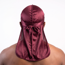 Premium Wine Red Silk Durag worn by male model, back view showing tied wrap and tail