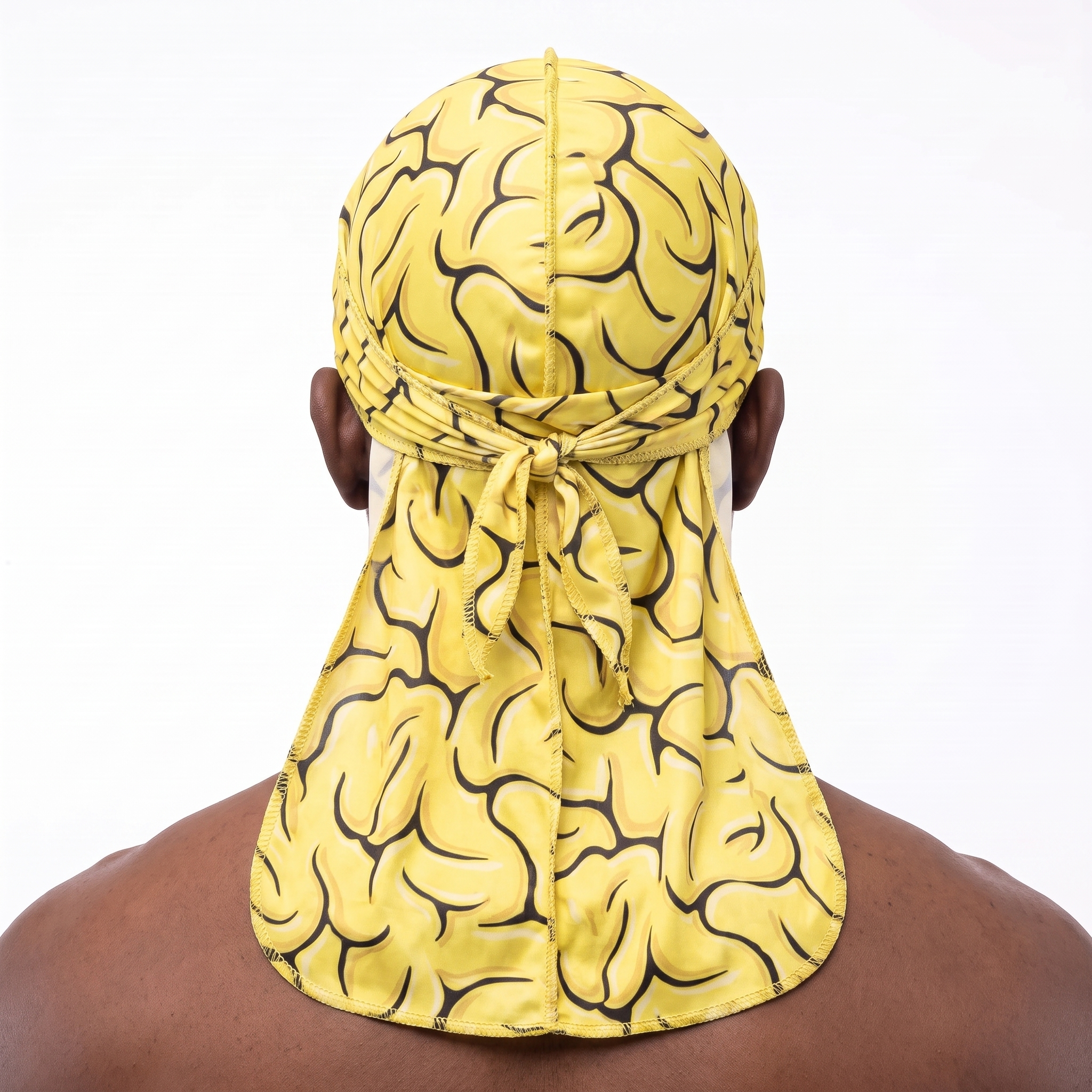 Yellow Brains graphic Satin Silky Durag worn by male model, back view showing tied wrap and tail