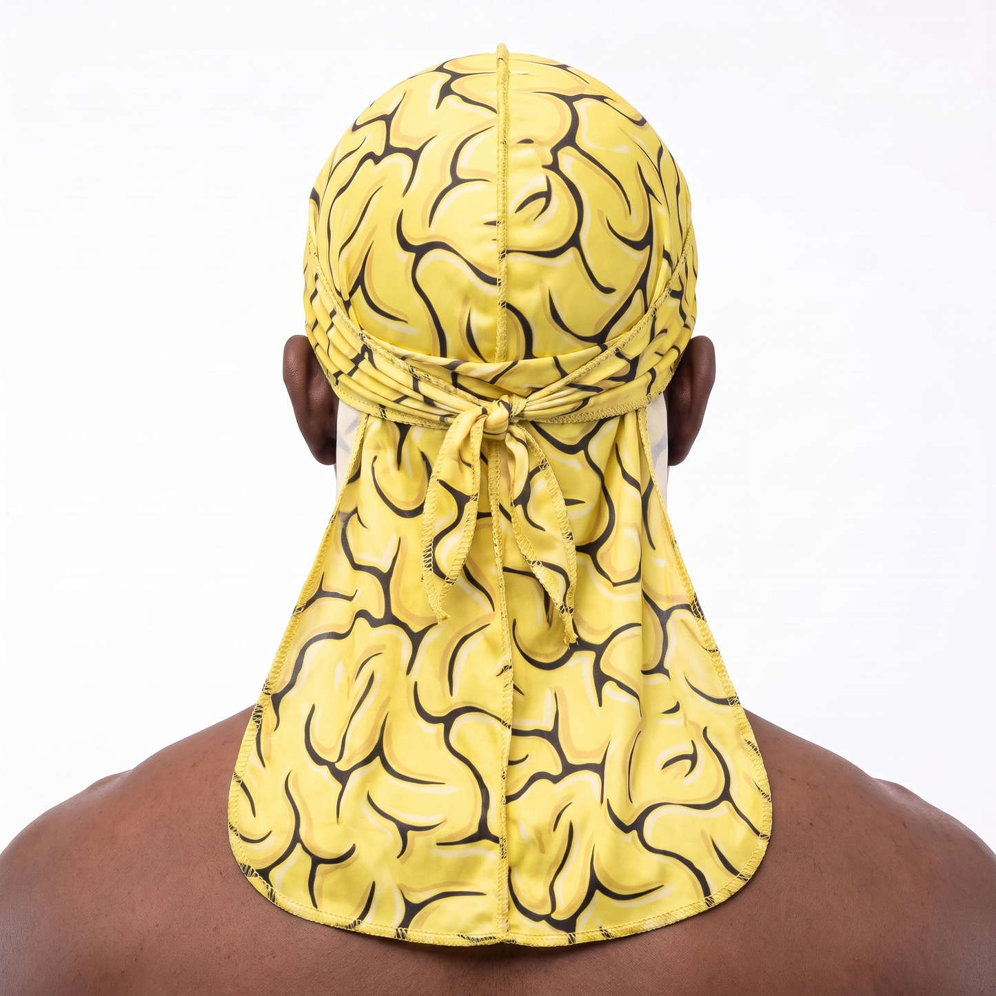 Yellow Brains graphic Satin Silky Durag worn by male model, back view showing tied wrap and tail