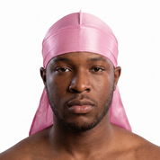 Premium Powder Pink Silk Durag worn by male model, front view on white background
