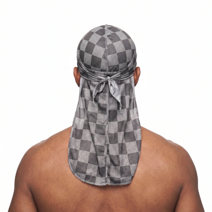 Checkered Greyscale Satin Silky Durag worn by male model, back view showing tied wrap and tail