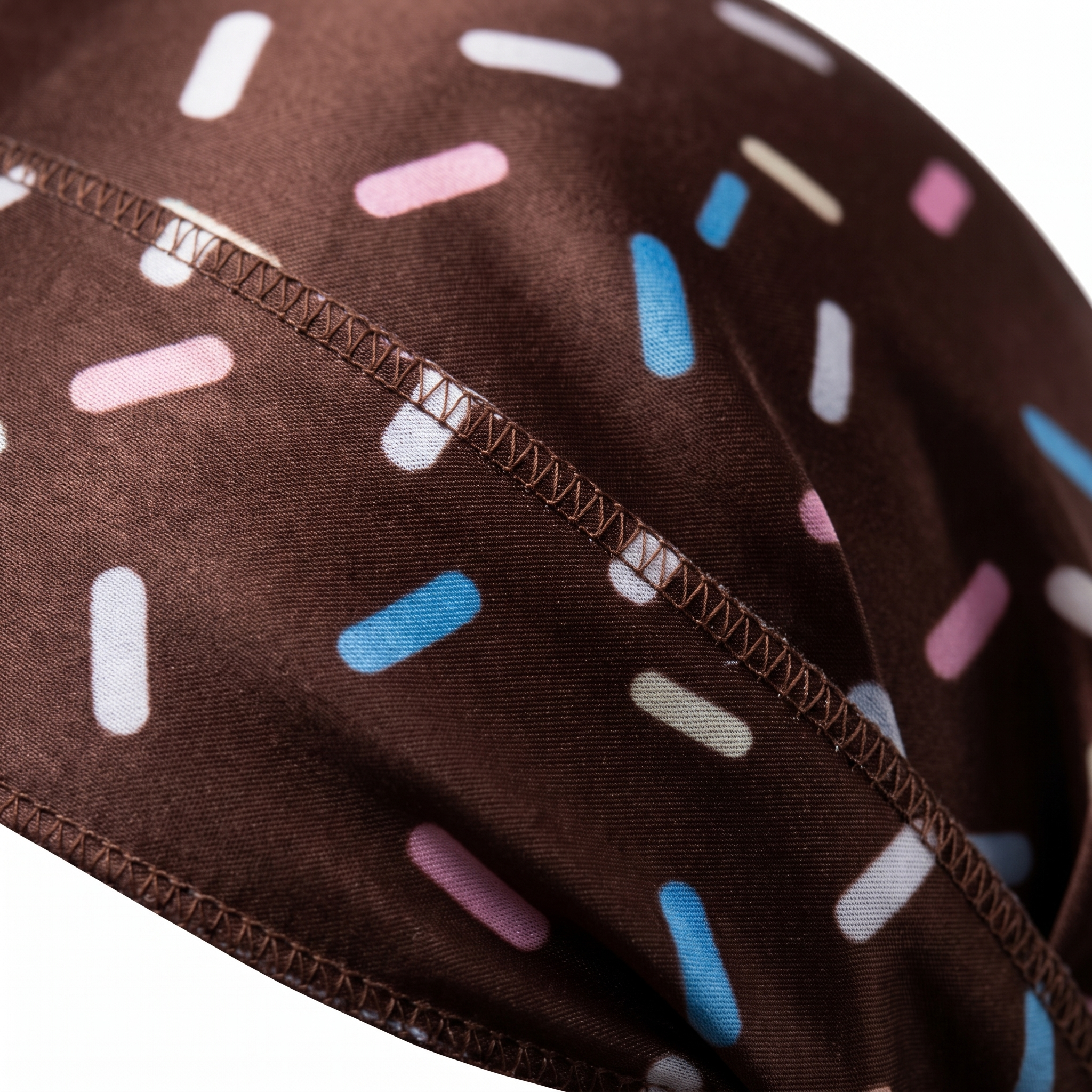 Dark brown ice cream sprinkle Satin Silky Durag fabric close-up showing Dark brown ice cream sprinkle print and stitching detail