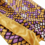 Yellow and Purple Mamba reptile snakeskin Satin Silky Durag fabric close-up showing Yellow and Purple Mamba reptile snakeskin print and stitching detail