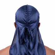 Premium Navy Blue Silk Durag worn by male model, back view showing tied wrap and tail