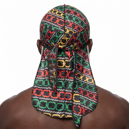 Juneteenth 1.0 red black and green Satin Silky Durag worn by male model, back view showing tied wrap and tail
