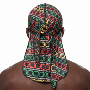 Juneteenth 1.0 red black and green Satin Silky Durag worn by male model, back view showing tied wrap and tail