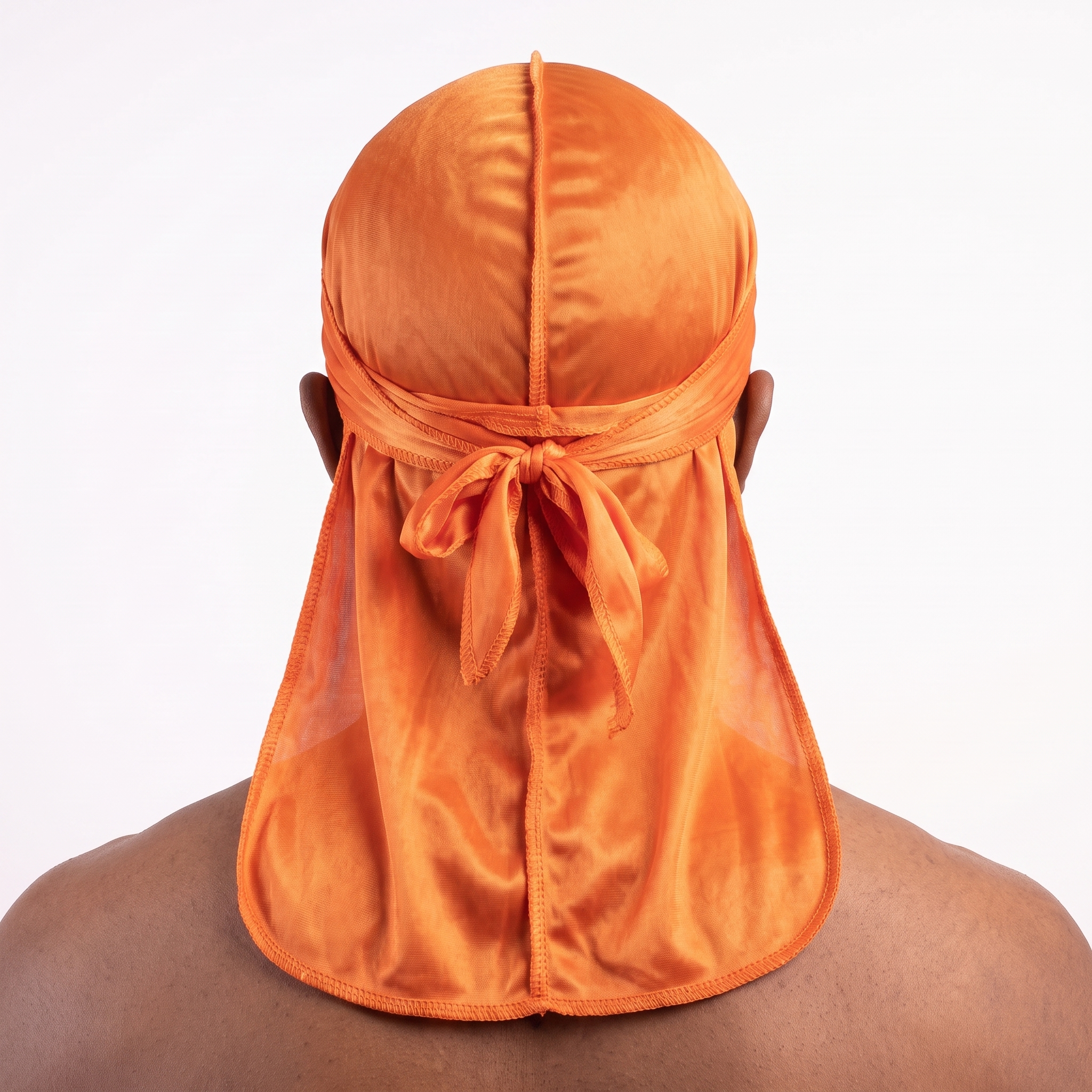 Premium Silk Durag Orange worn by male model, back view showing tied wrap and tail
