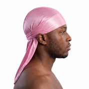 Premium Powder Pink Silk Durag worn by male model, side profile showing fit and tail drape