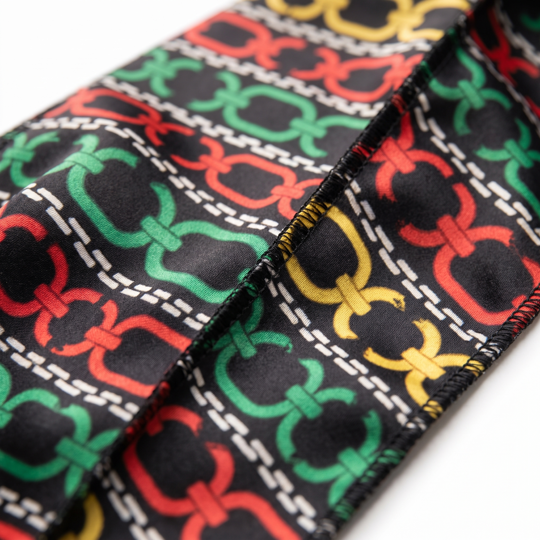 Juneteenth 1.0 red black and green Satin Silky Durag fabric close-up showing Juneteenth 1.0 red black and green print and stitching detail