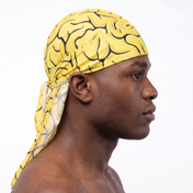 Yellow Brains graphic Satin Silky Durag worn by male model, side profile showing fit and tail drape