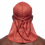 Red and Brown Maze geometric Satin Silky Durag worn by male model, back view showing tied wrap and tail