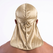 Premium Champagne Gold Silk Durag worn by male model, back view showing tied wrap and tail