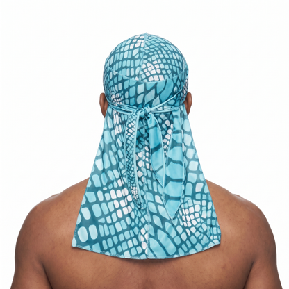 Diamond Blue reptile snakeskin Satin Silky Durag worn by male model, back view showing tied wrap and tail
