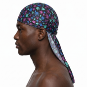 Cannabis Purple and Blue leaf print Satin Silky Durag worn by male model, side profile showing fit and tail drape