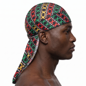 Juneteenth 1.0 red black and green Satin Silky Durag worn by male model, side profile showing fit and tail drape