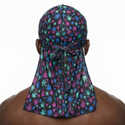 Cannabis Purple and Blue leaf print Satin Silky Durag worn by male model, back view showing tied wrap and tail