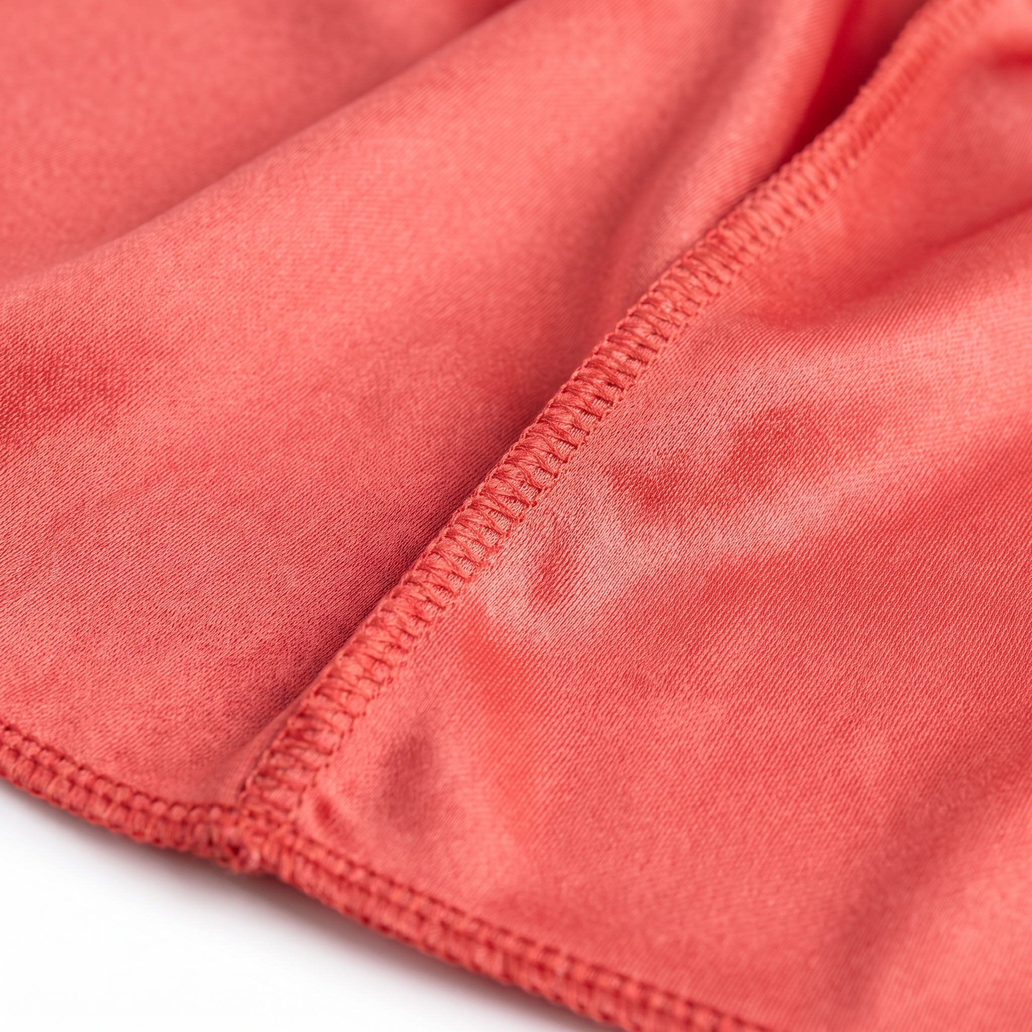 Premium Coral Red Silk Durag fabric close-up showing Coral Red silky satin texture and stitching detail