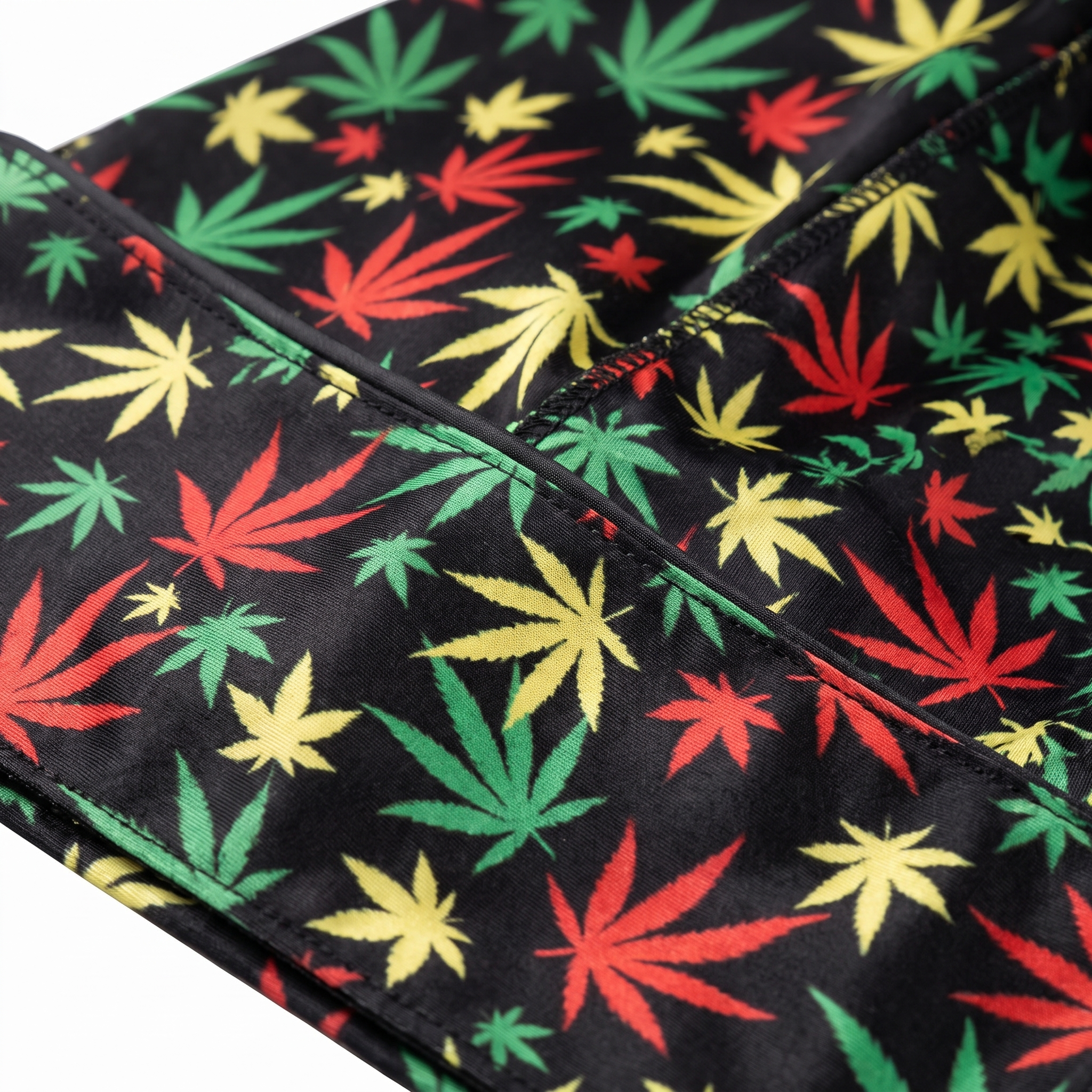 Cannabis Rasta leaf print Satin Silky Durag fabric close-up showing Cannabis Rasta leaf print print and stitching detail