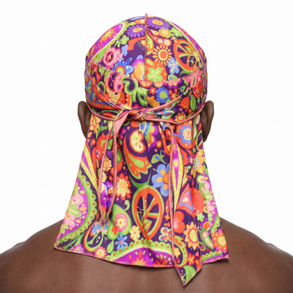Black Hippie graphic Satin Silky Durag worn by male model, back view showing tied wrap and tail