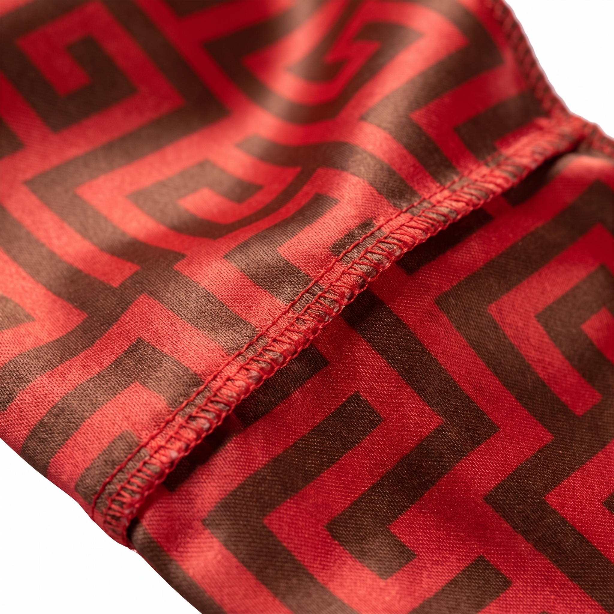 Red and Brown Maze geometric Satin Silky Durag fabric close-up showing Red and Brown Maze geometric print and stitching detail