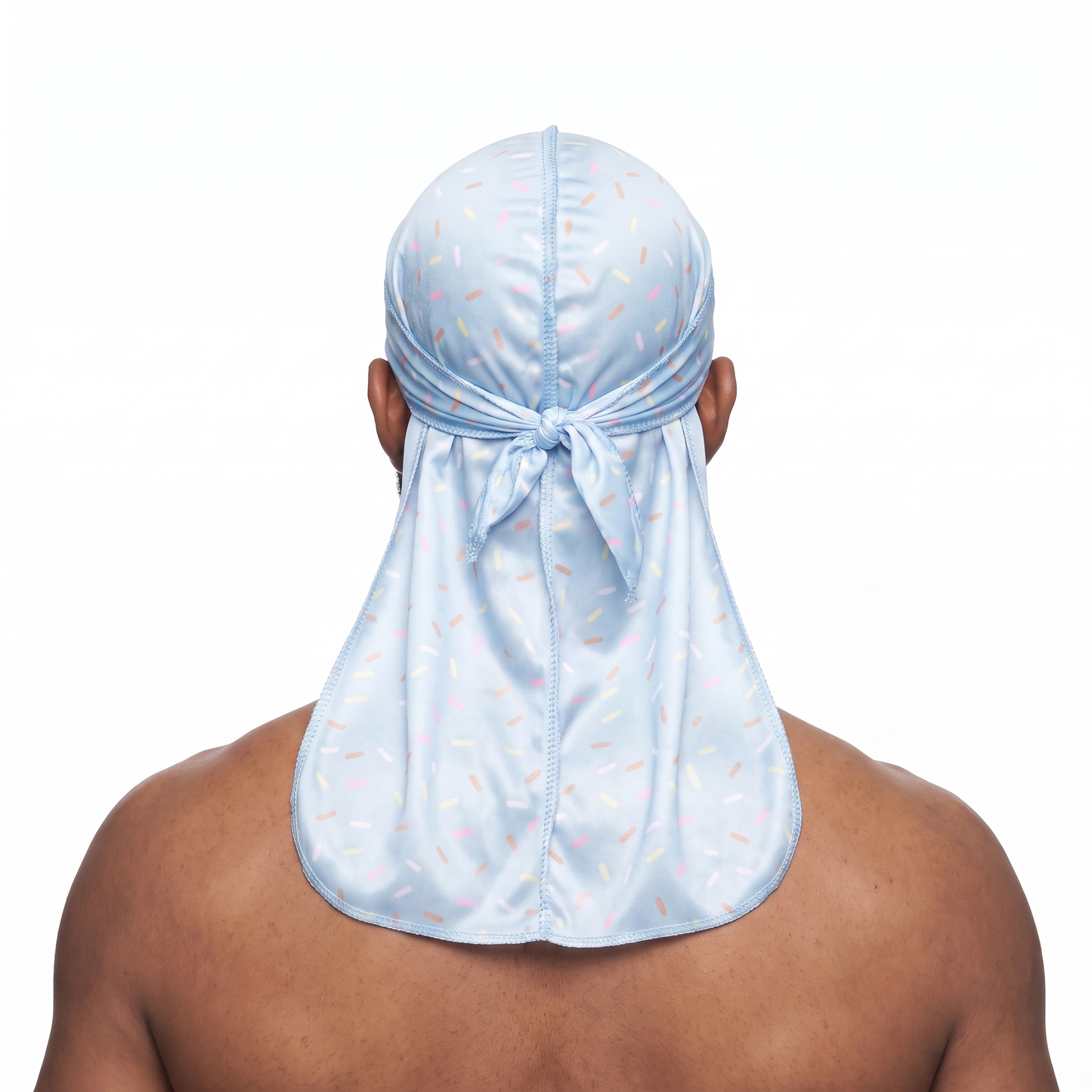 Blue ice cream sprinkle Satin Silky Durag worn by male model, back view showing tied wrap and tail