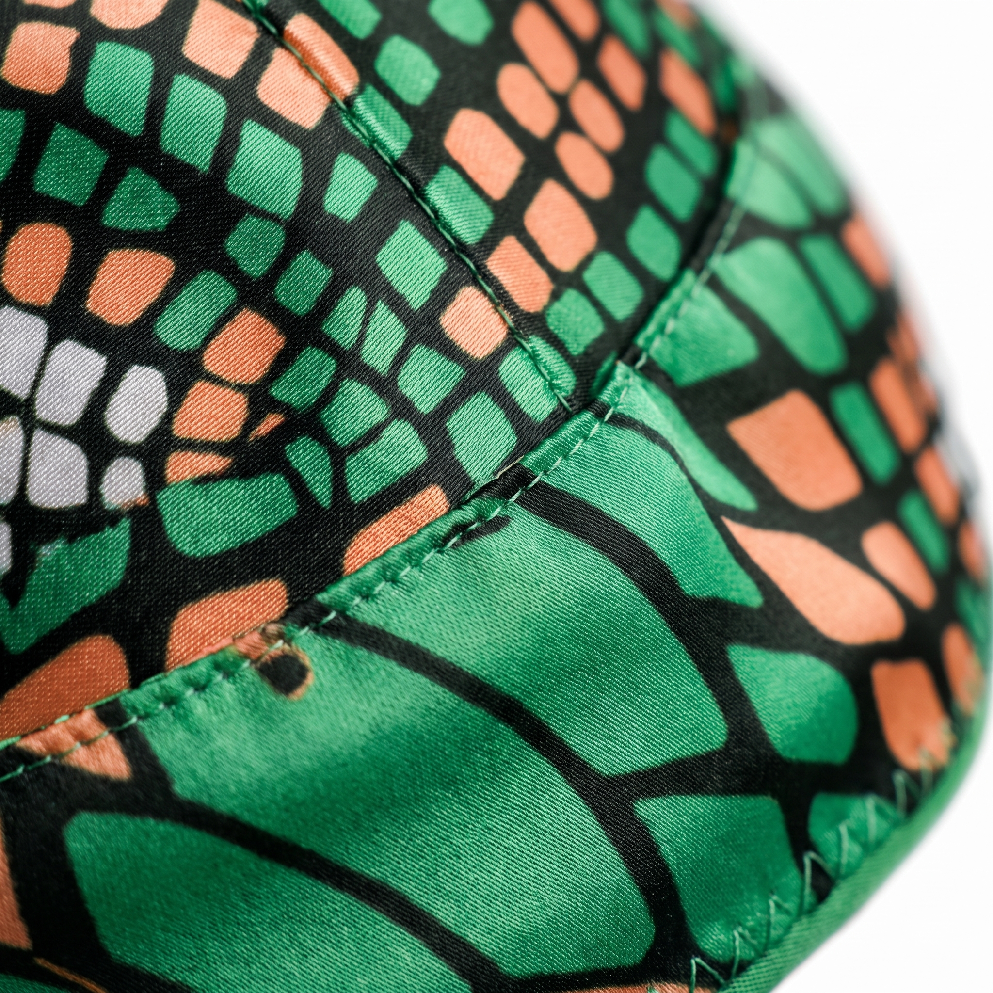 Green and Orange Famu reptile snakeskin Satin Silky Durag fabric close-up showing Green and Orange Famu reptile snakeskin print and stitching detail