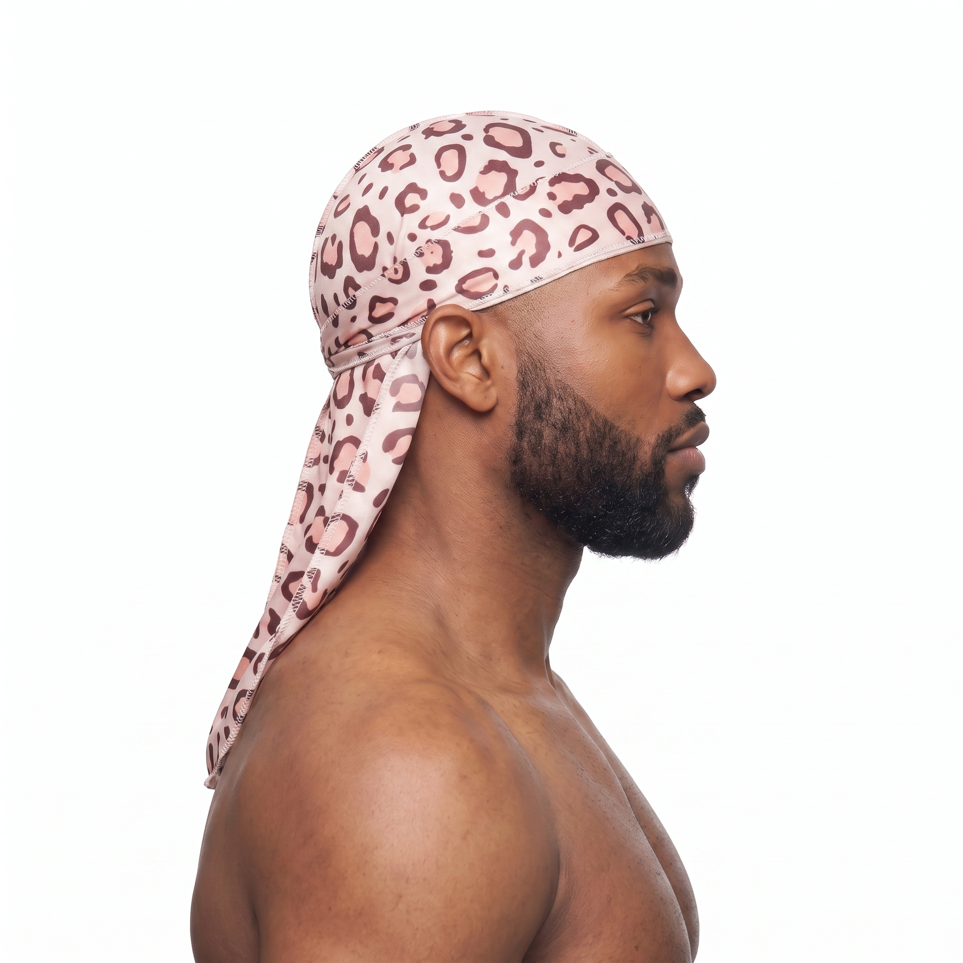 Pink leopard animal print Satin Silky Durag worn by male model, side profile showing fit and tail drape