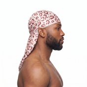 Pink leopard animal print Satin Silky Durag worn by male model, side profile showing fit and tail drape