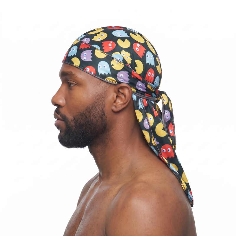 Pac-Man retro arcade Satin Silky Durag worn by male model, side profile showing fit and tail drape