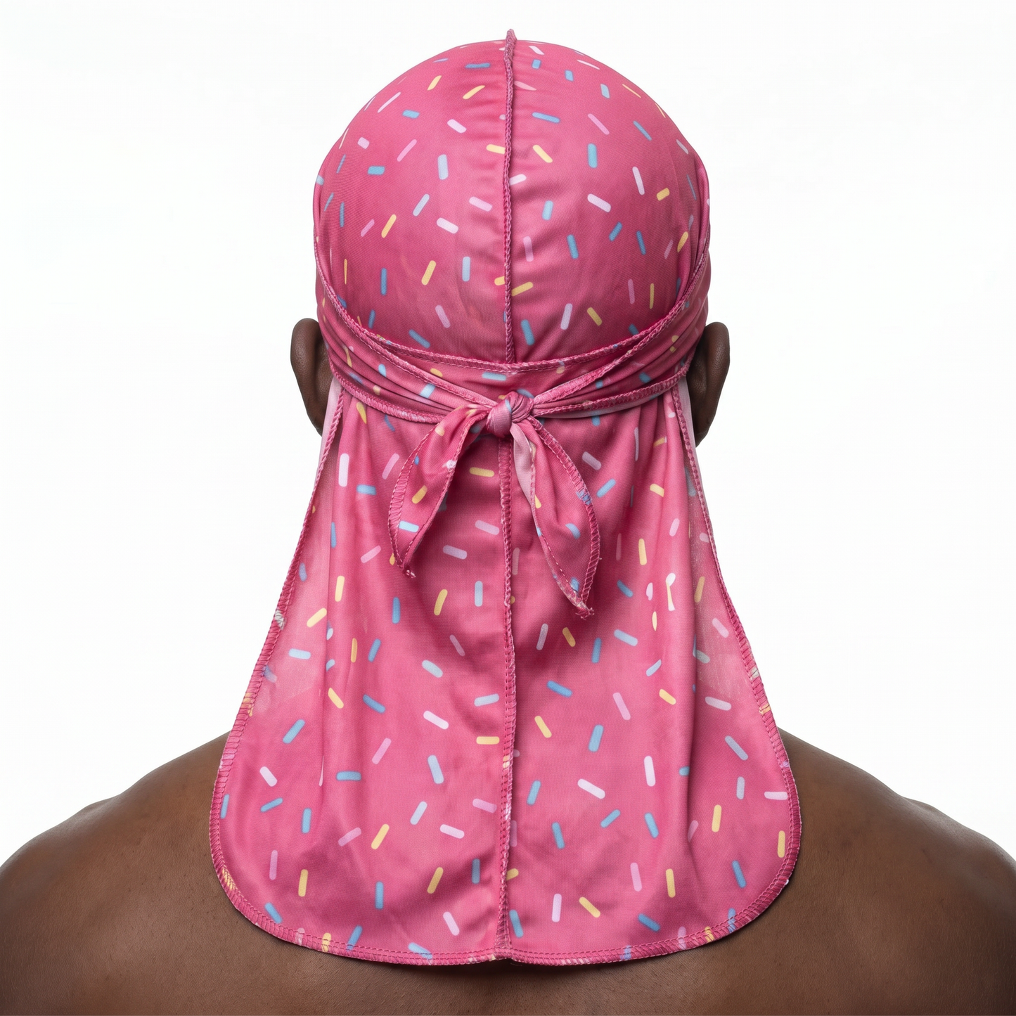 Dark pink ice cream sprinkle Satin Silky Durag worn by male model, back view showing tied wrap and tail