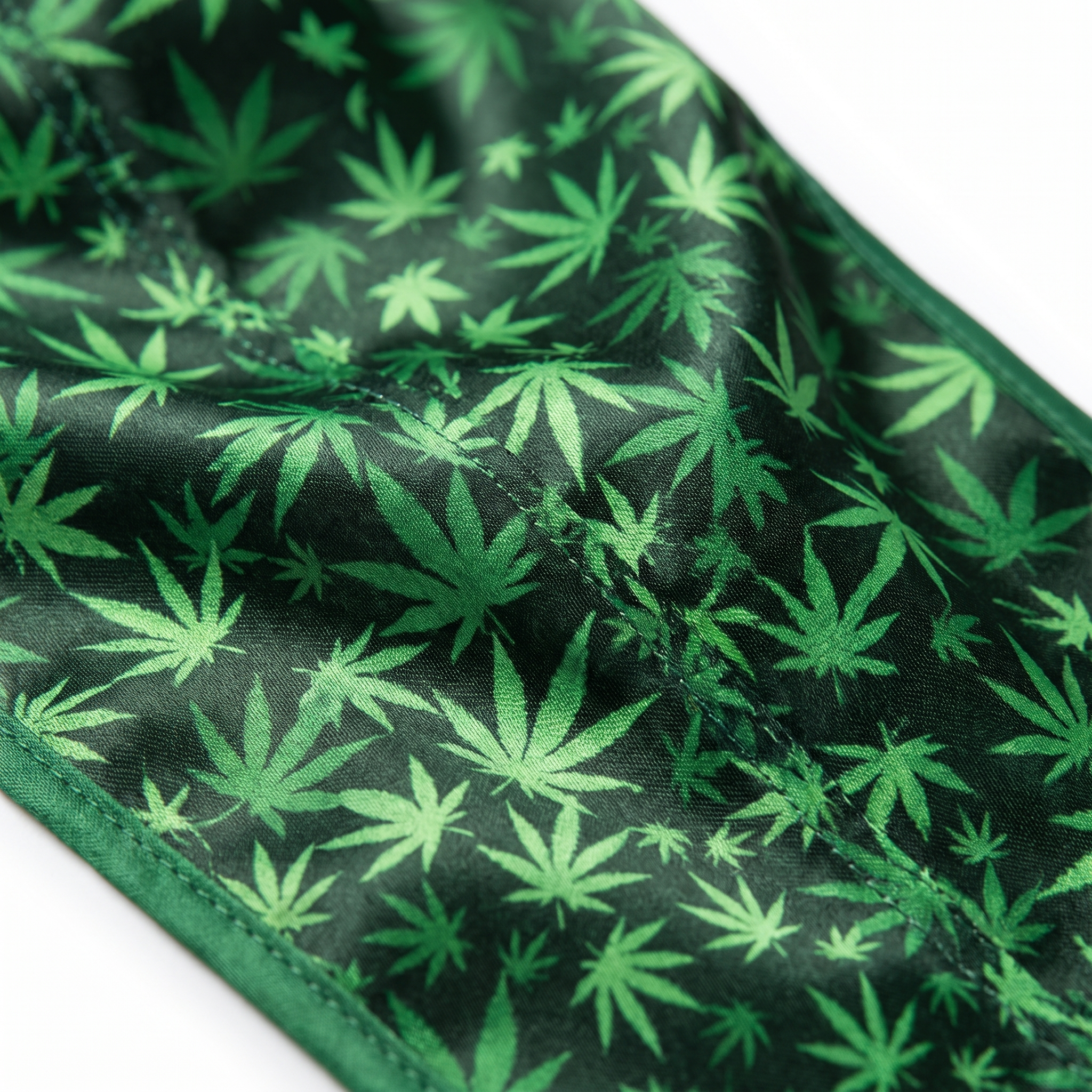 Cannabis Green leaf print Satin Silky Durag fabric close-up showing Cannabis Green leaf print print and stitching detail