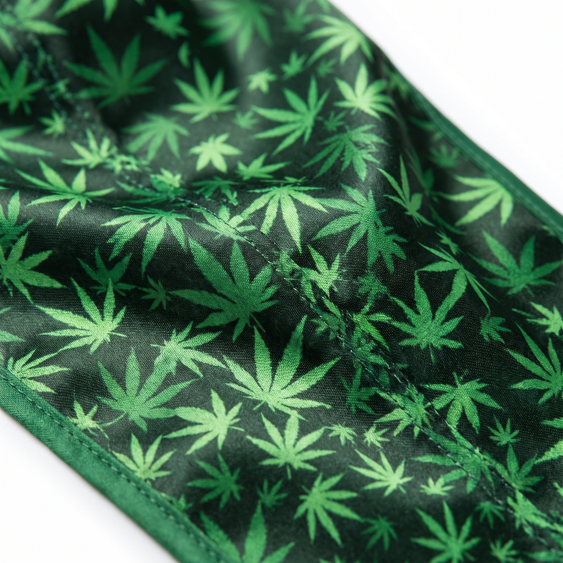 Cannabis Green leaf print Satin Silky Durag fabric close-up showing Cannabis Green leaf print print and stitching detail