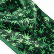 Cannabis Green leaf print Satin Silky Durag fabric close-up showing Cannabis Green leaf print print and stitching detail