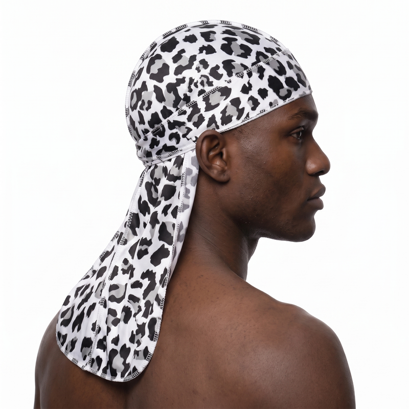 Snow Leopard spotted animal print Satin Silky Durag worn by male model, side profile showing fit and tail drape