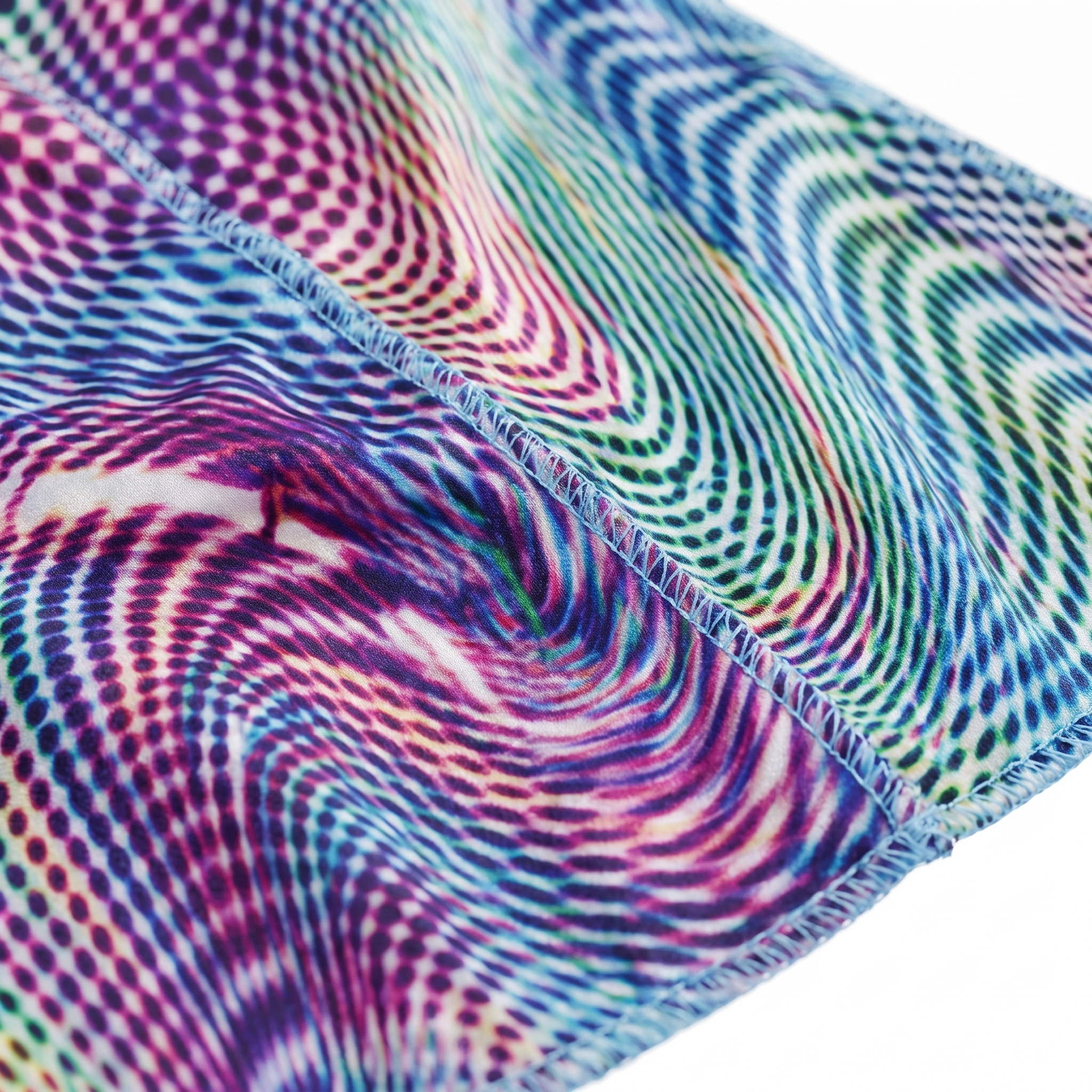 Purple optical illusion swirl Satin Silky Durag fabric close-up showing Purple optical illusion swirl print and stitching detail