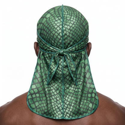 Green reptile snakeskin Satin Silky Durag worn by male model, back view showing tied wrap and tail