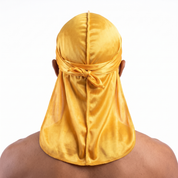 Premium Silk Durag Butterscotch Yellow worn by male model, back view showing tied wrap and tail