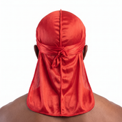 Premium Toronto Red Silk Durag worn by male model, back view showing tied wrap and tail