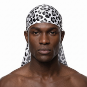 Snow Leopard spotted animal print Satin Silky Durag worn by male model, front view on white background