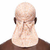 Peach crocodile skin Satin Silky Durag worn by male model, back view showing tied wrap and tail