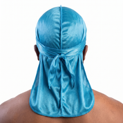 Premium Turquoise Blue Silk Durag worn by male model, back view showing tied wrap and tail