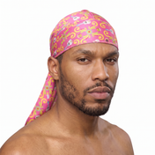 Cinco De Mayo Pink festive Satin Silky Durag worn by male model, front view on white background
