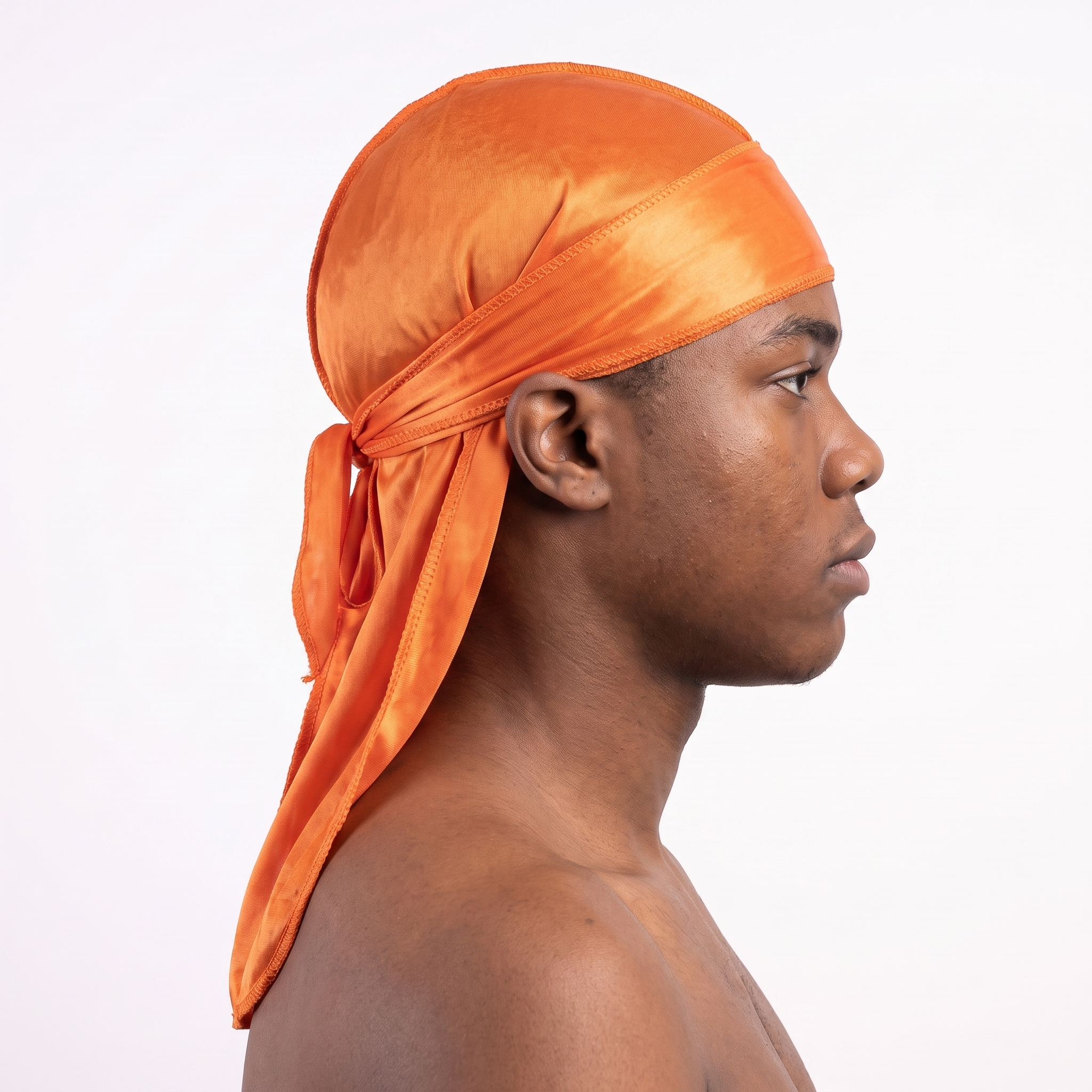 Premium Silk Durag Orange worn by male model, side profile showing fit and tail drape